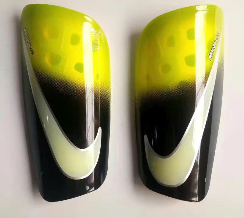 Caneleiras Nike Mercurial Lite Preto neon